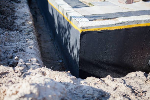 Professional Exterior Waterproofing technician working in Belleville, MI